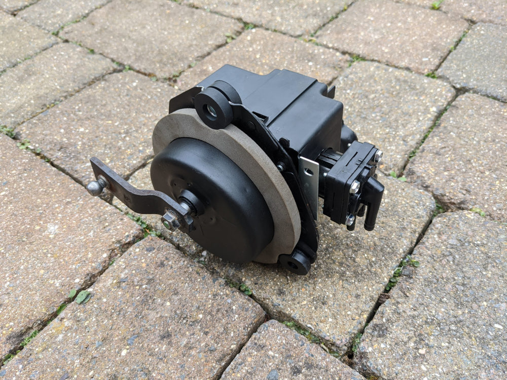 The back of the wiper motor with new seal and reusing the old connector link